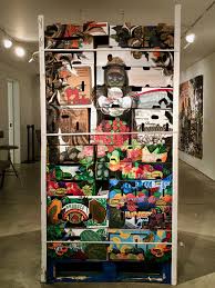 Friends in Freshness, 2017 by Narsiso Martinez. Ink, gouache, charcoal and collage on produce cardboard boxes. 78 x 40 x 48 in